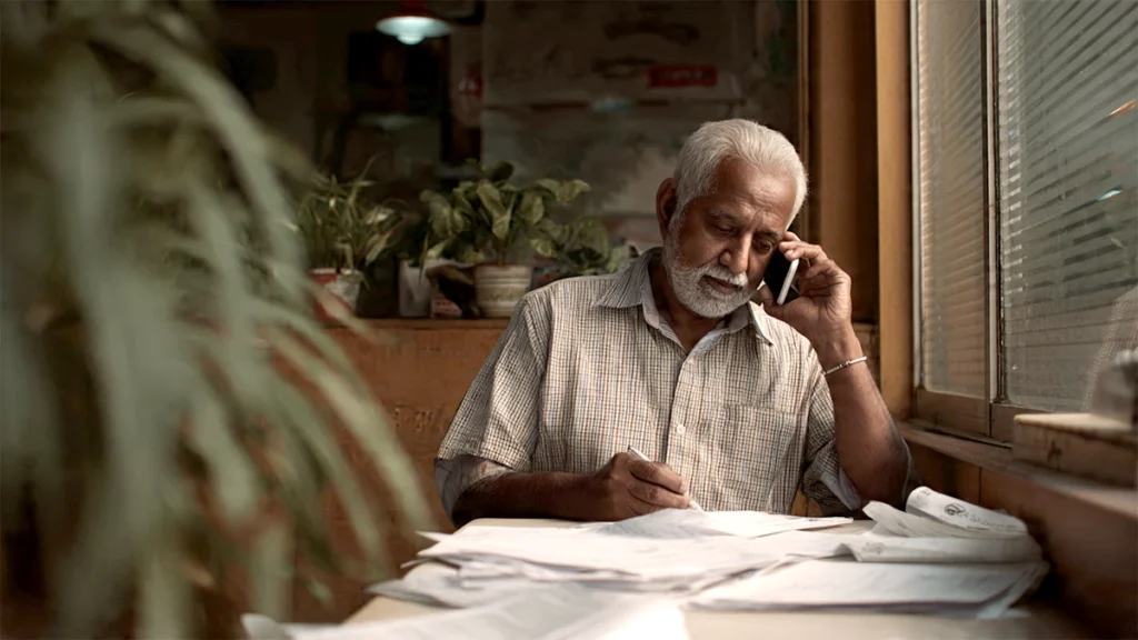 Policyholder filing insurance claim and submitting documents in India